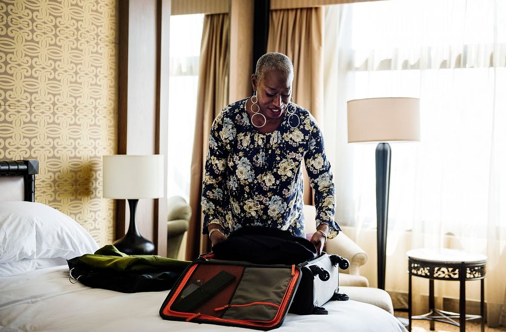 Woman unpacking her suitcase