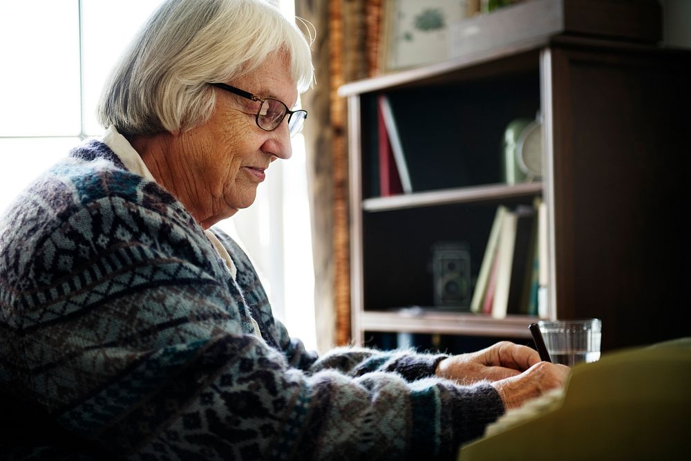 Senior woman writing a letter