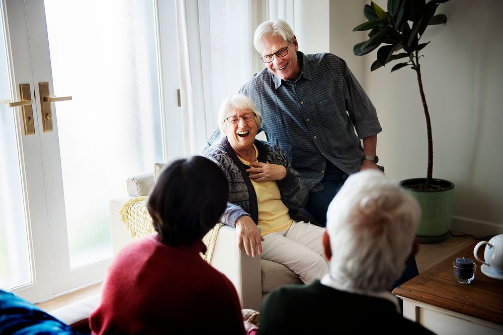 Senior people talking in living room