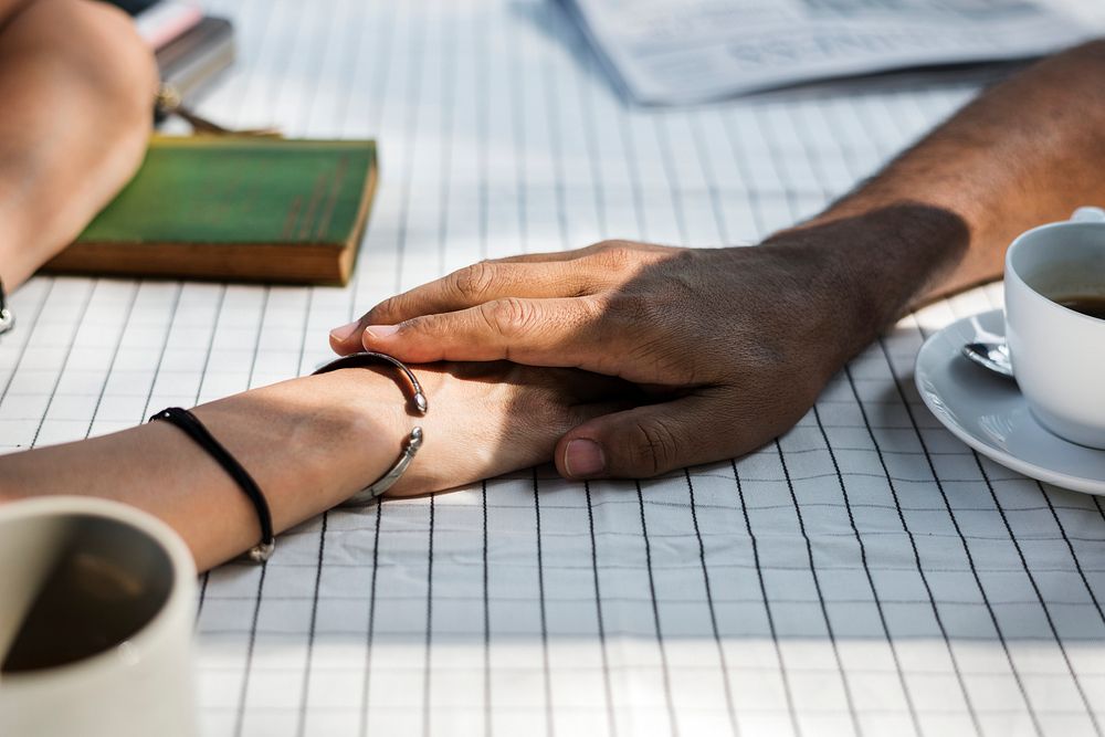 Couple holding hands