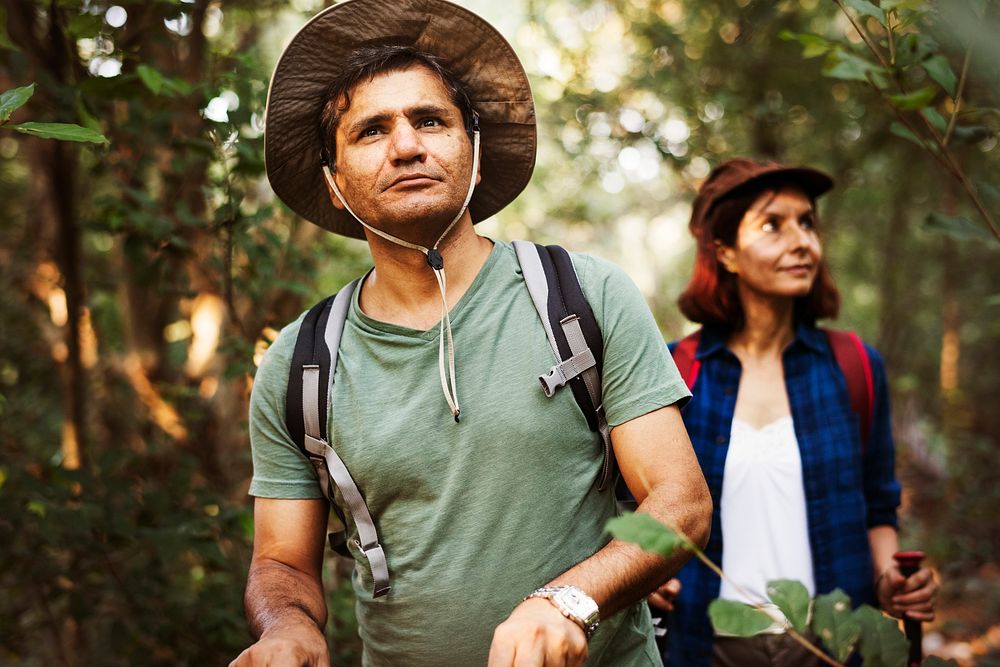 Couple trekking together in a forest