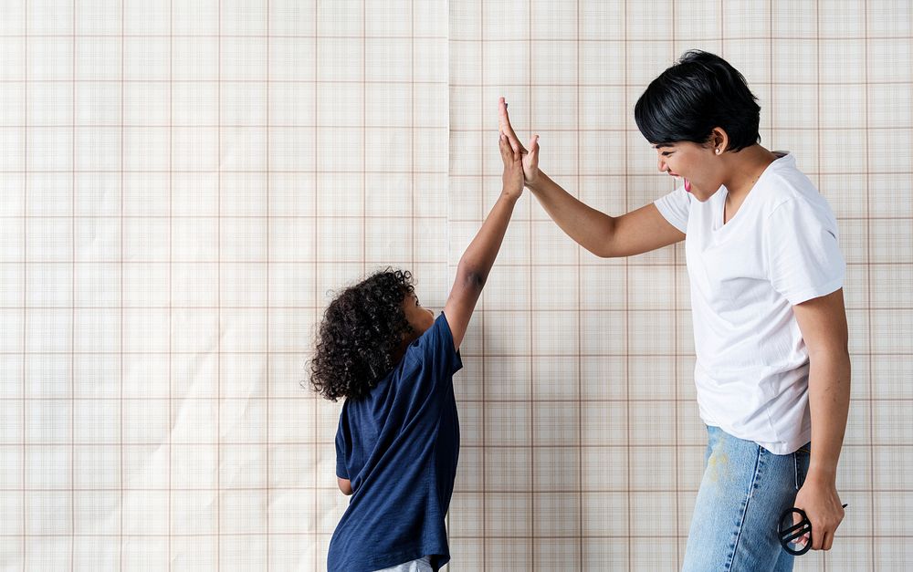 Young boy helping mom