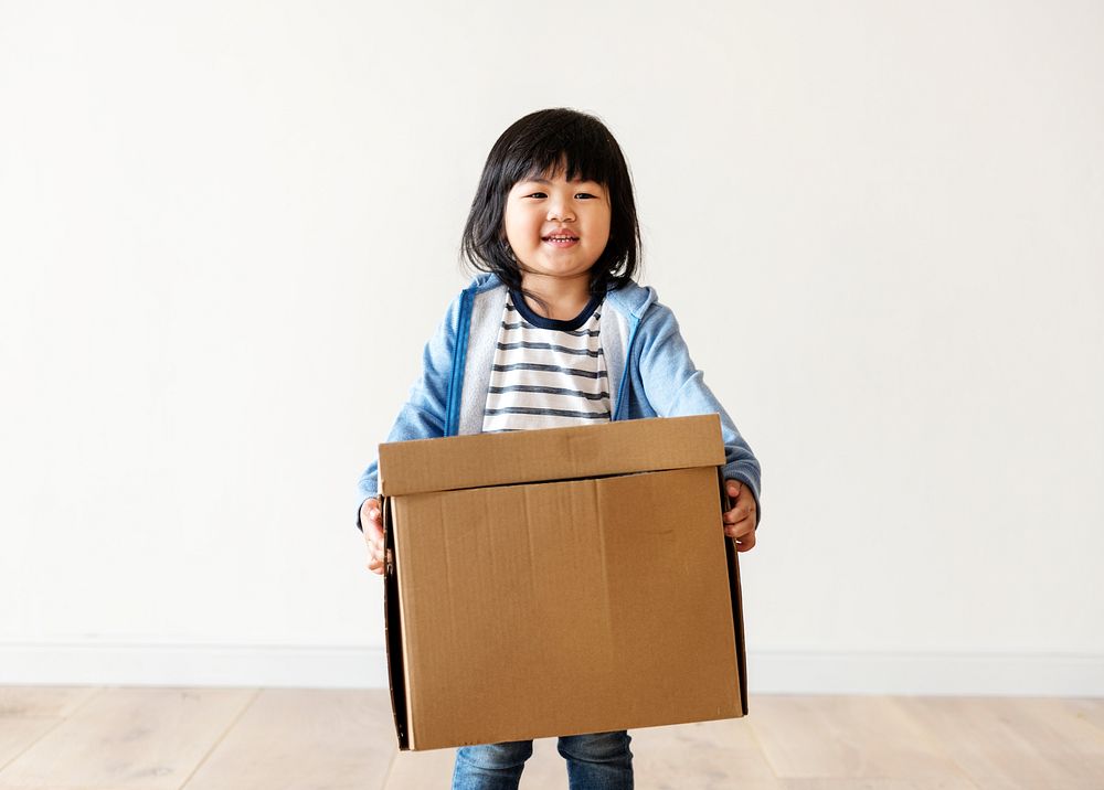 Asian kid helping move now house