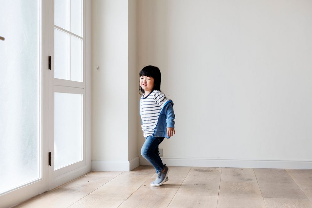 A cheerful Asian girl in new house