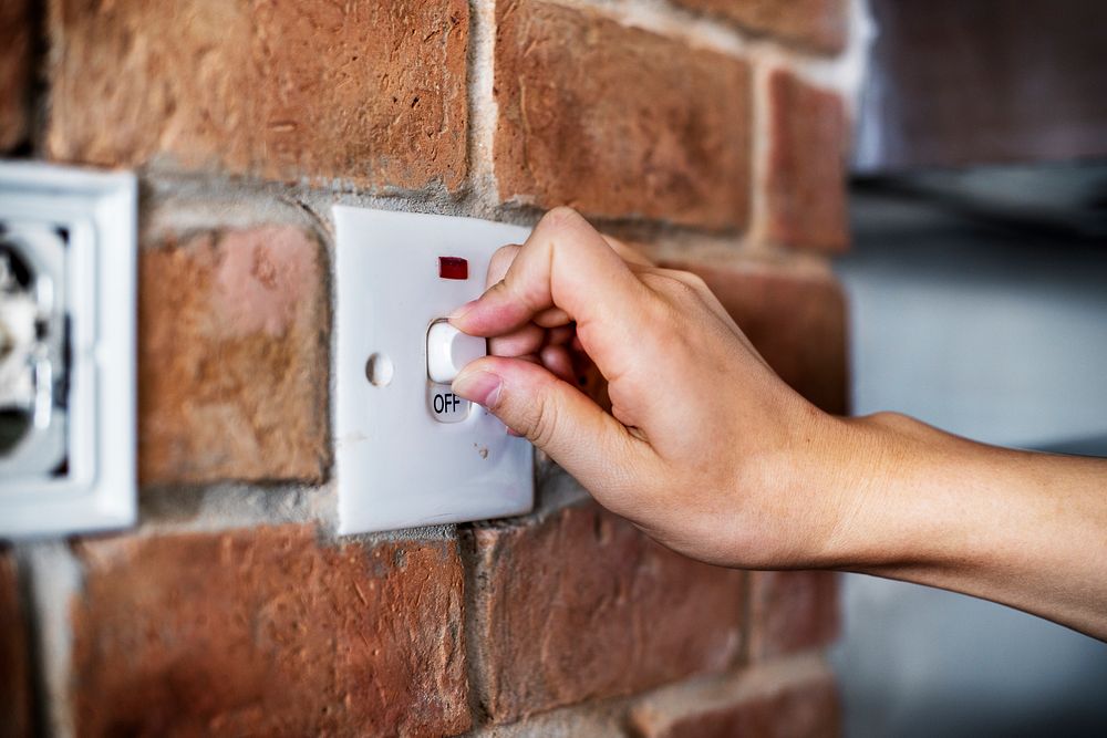 Closeup of switch on brick wall