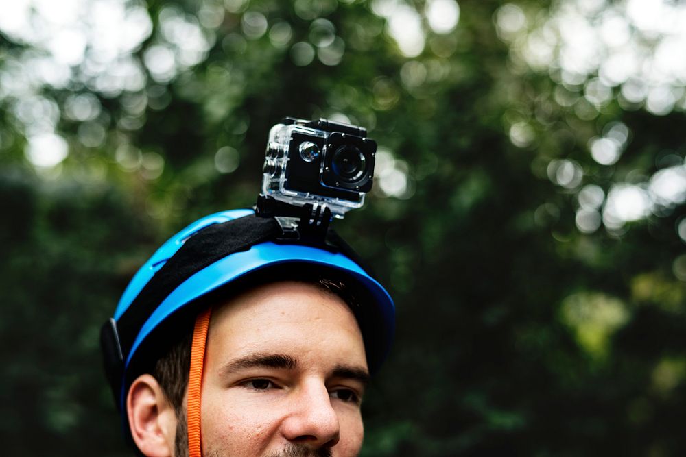 Man wearing safety helmet with video record camera