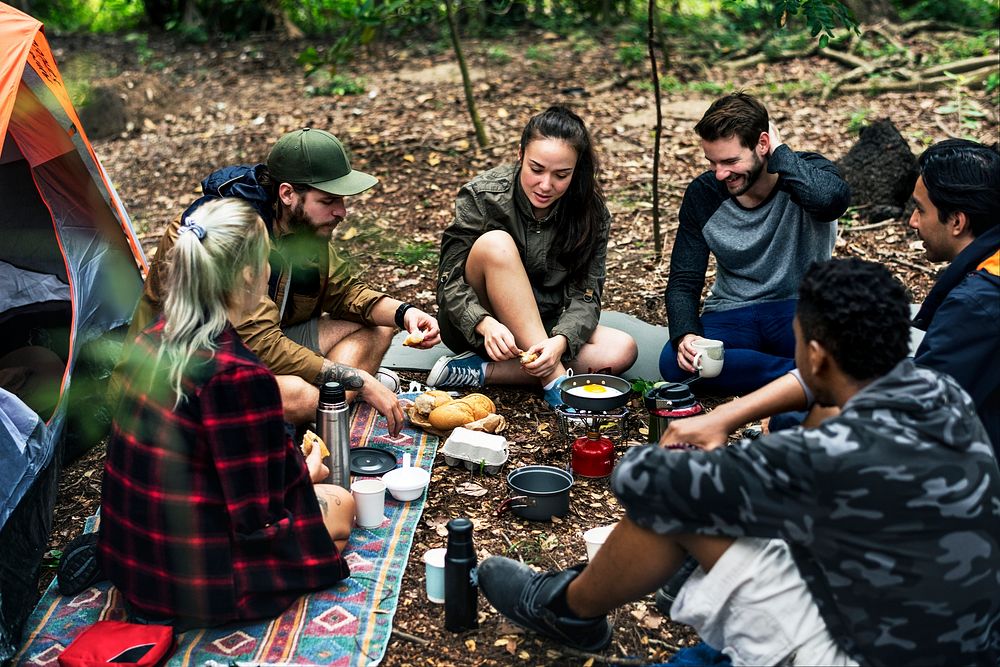 Friends camping in the forest together