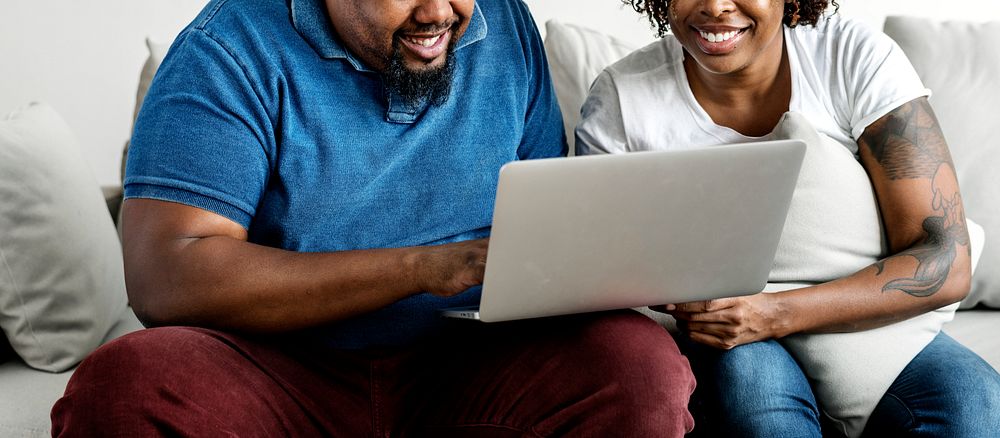 Black couple using digital device
