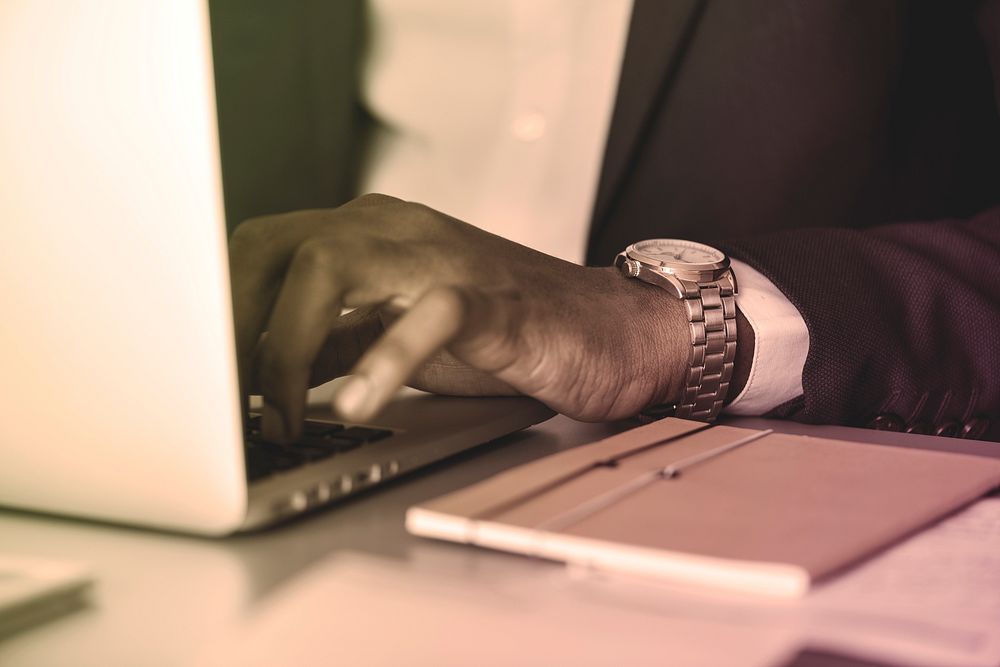 Black businessman using computer laptop