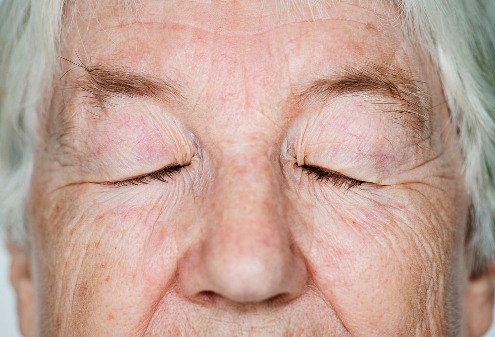 Portrait of a white elderly woman eyes closed