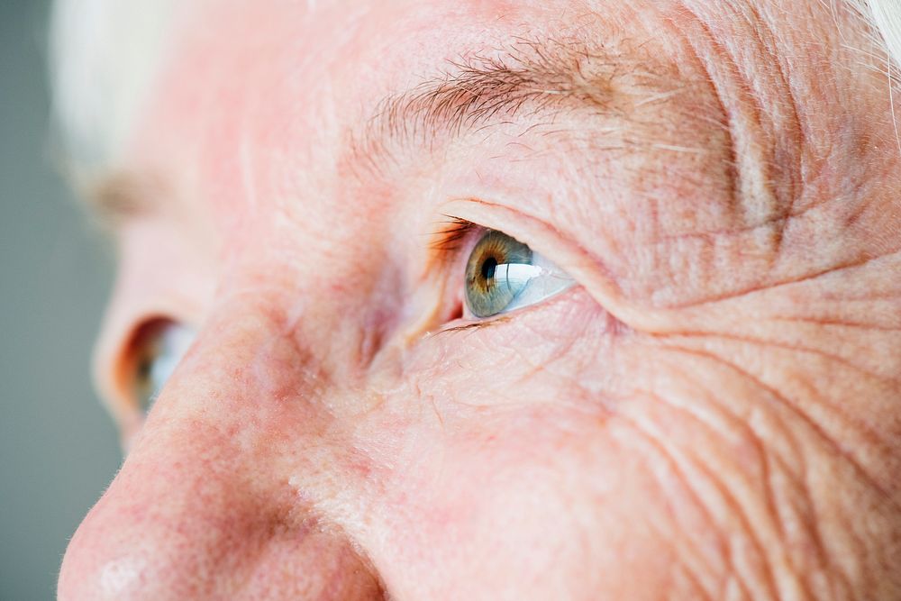 Closeup side portrait of white elderly woman's eyes