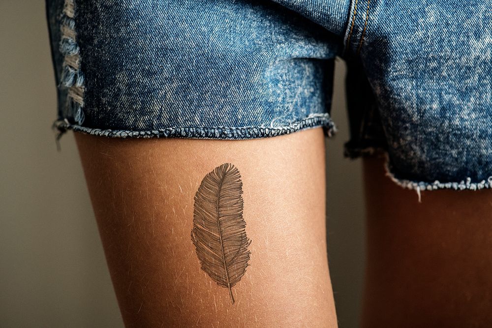 Closeup of a upper thigh tattoo of a woman