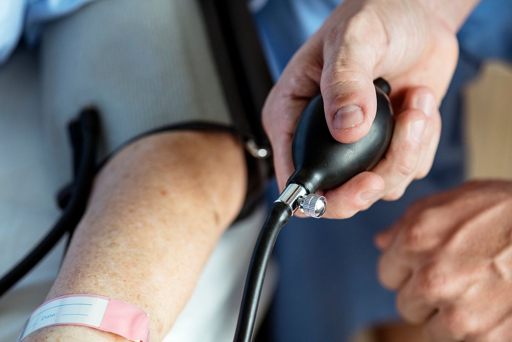 Elderly woman checking blood pressure