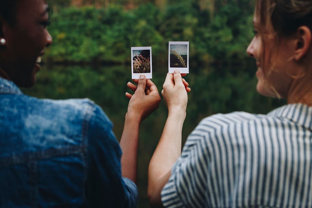 Two young female adult friends outdoors friendship bonding and photography concept