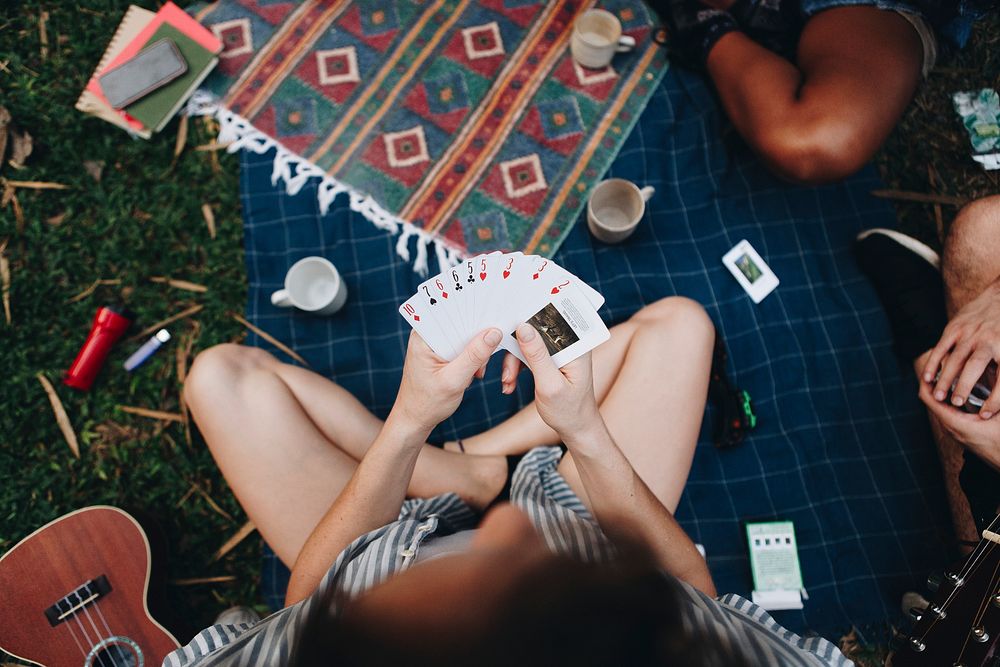 Group of friends playing a card game