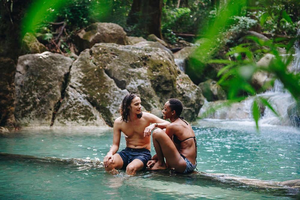 Couple enjoying the waterfall