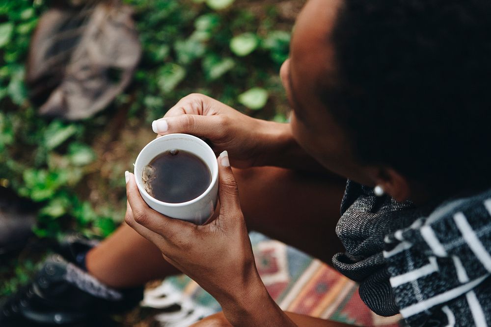 Woman enjoying her morning coffee in nature