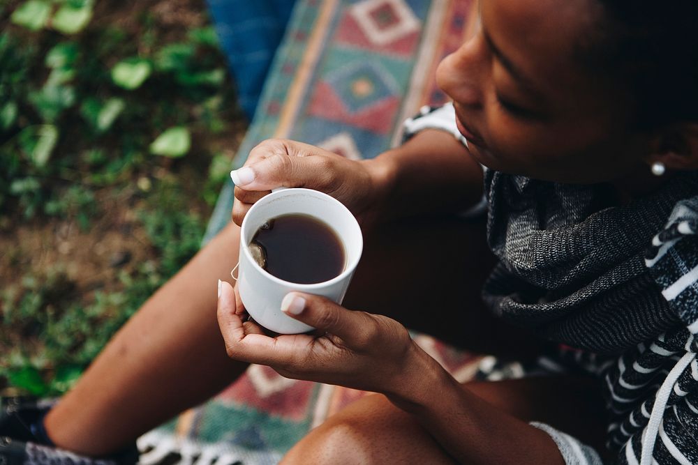 Woman enjoying morning coffee with nature