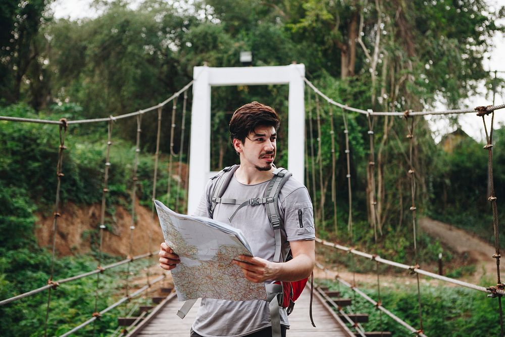 Caucasian man looking at a map travel and explore concept