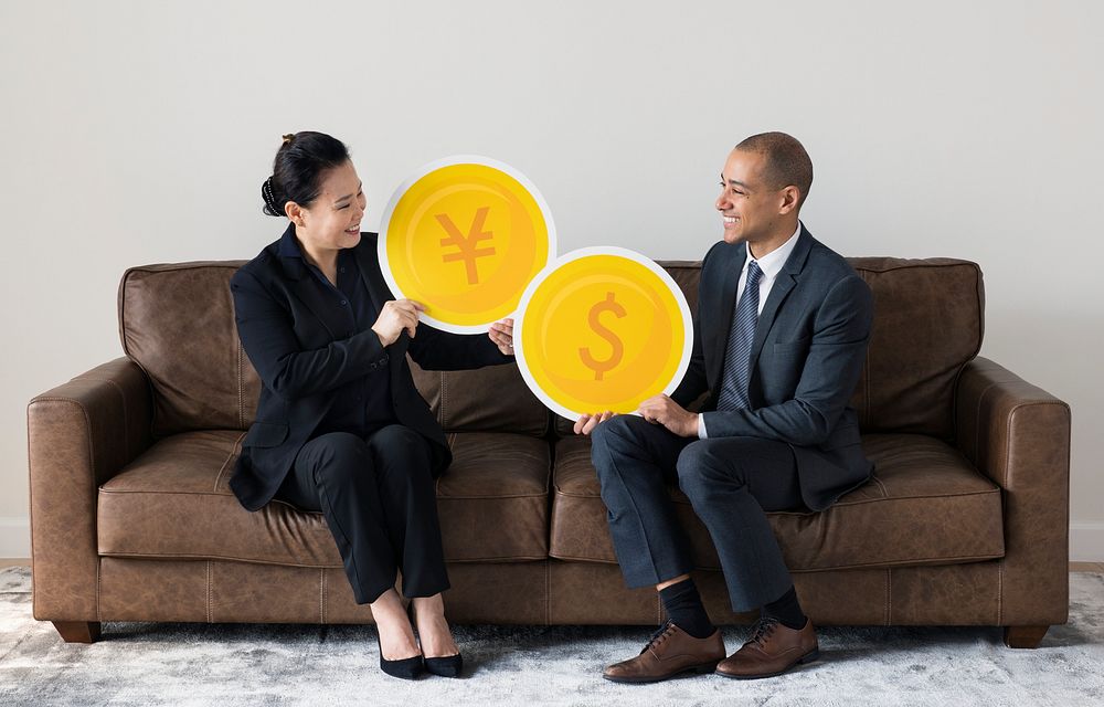 Business people holding currency icons