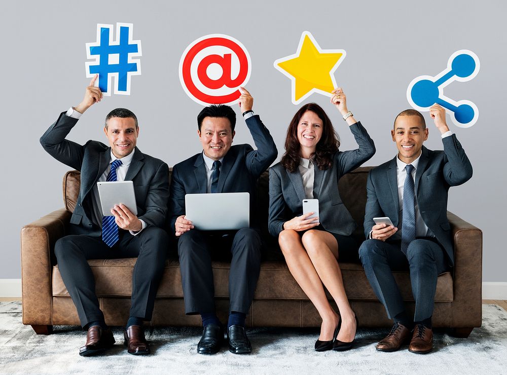 Business people holding social network icons