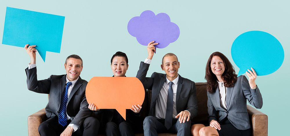 Cheerful business people holding speech bubble icon