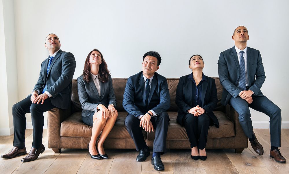 Business people sitting together on couch