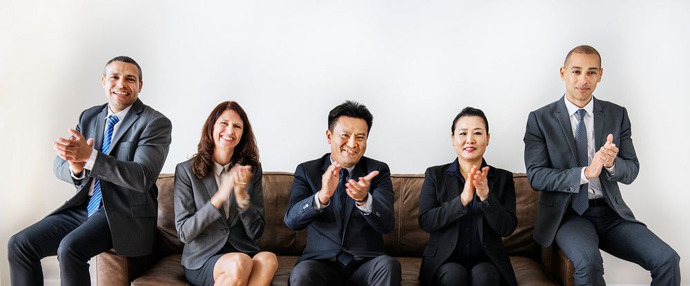 Business people sitting together on couch