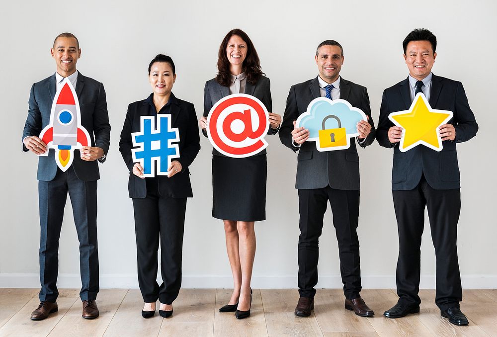 Business people standing and holding icons