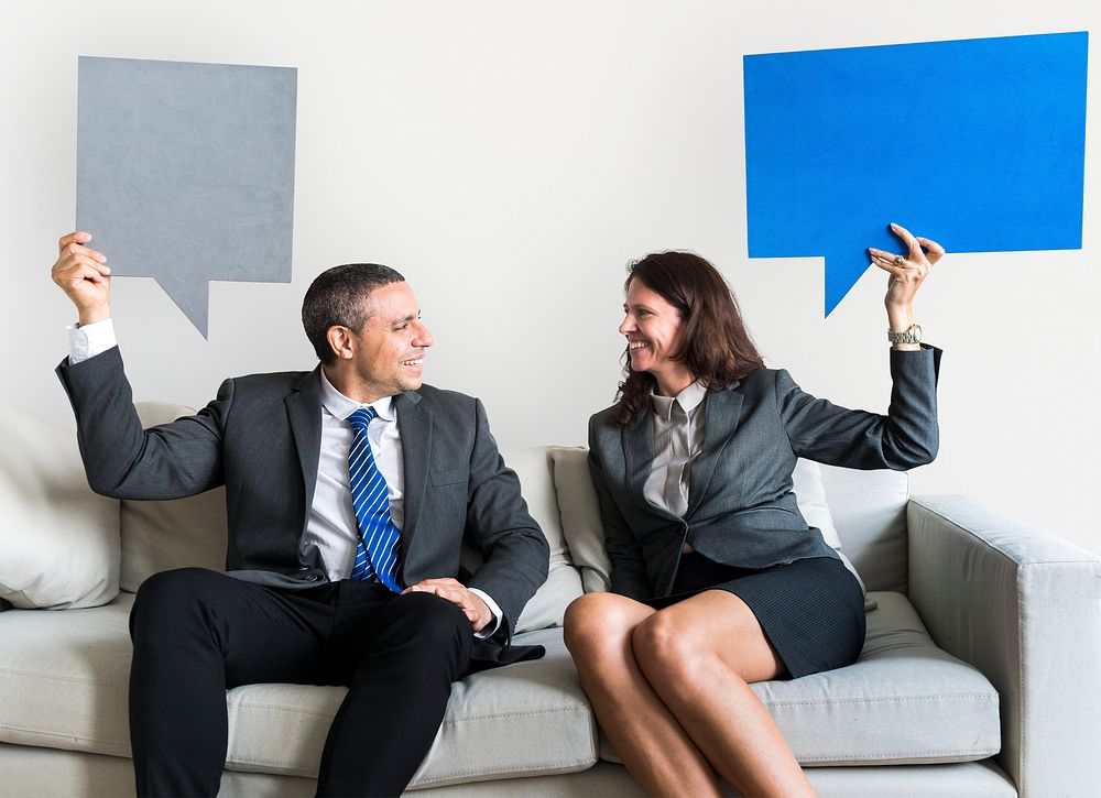 Business couple with speech bubbles
