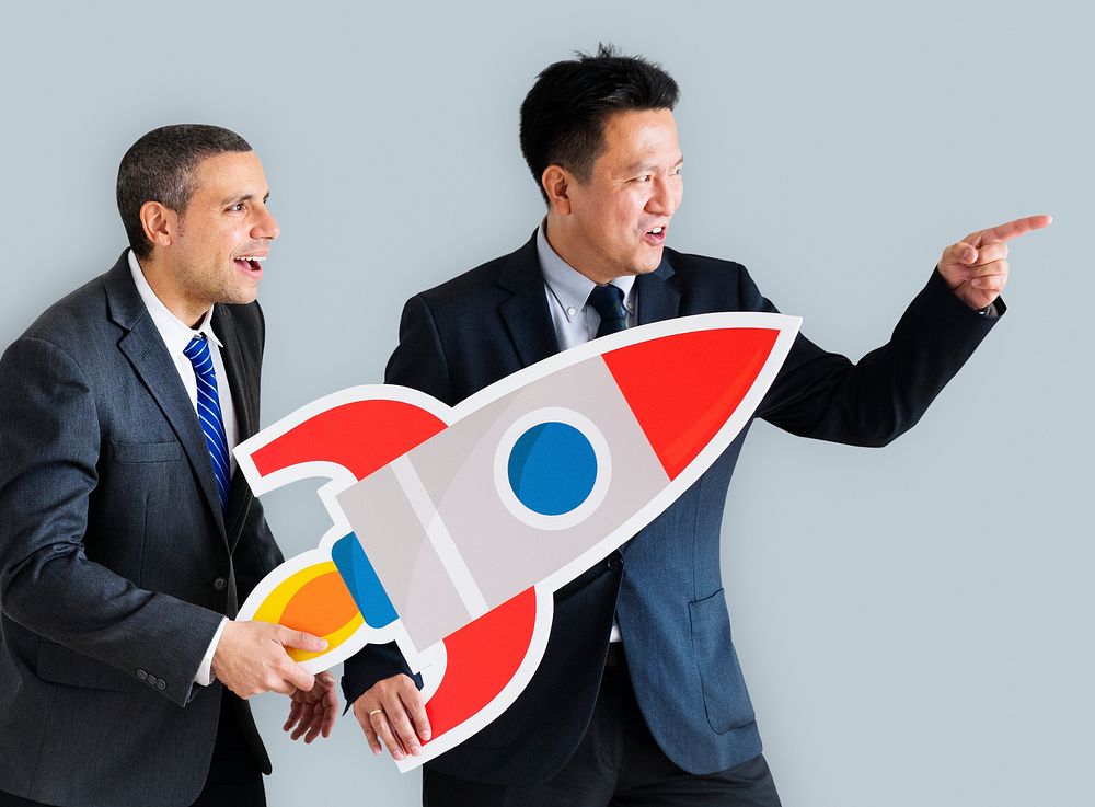 Businessmen holding launching rocket icon