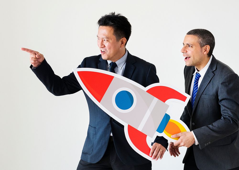 Businessmen holding rocket icon