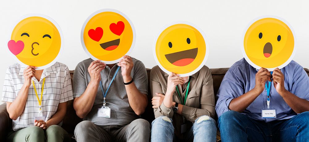 Diverse people covered with emoticons