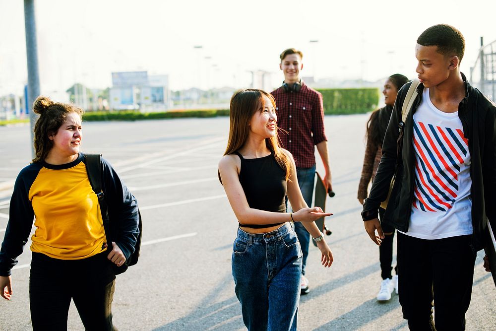 Group of diverse teenagers hanging out together