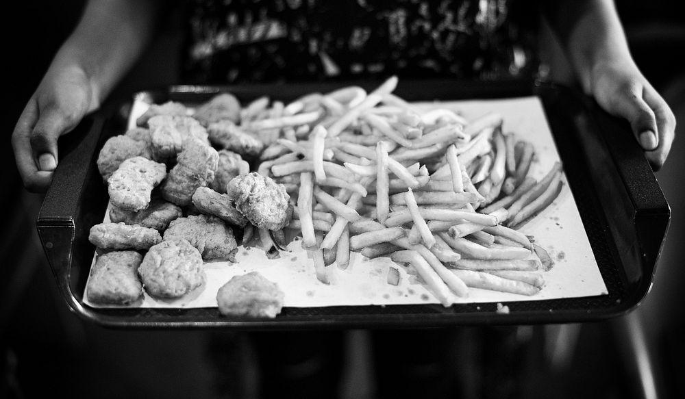 Tray of junk food fast food chicken nuggets and french fries