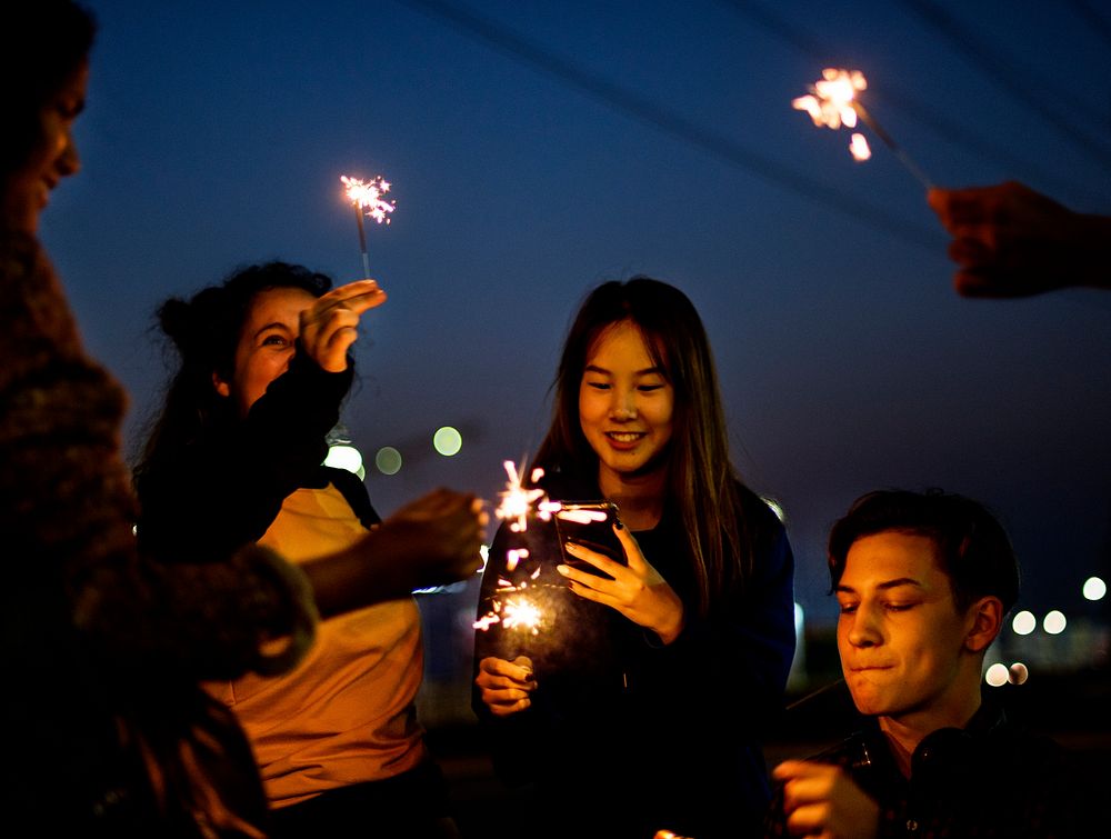 Group of school friends happiness and playing firework