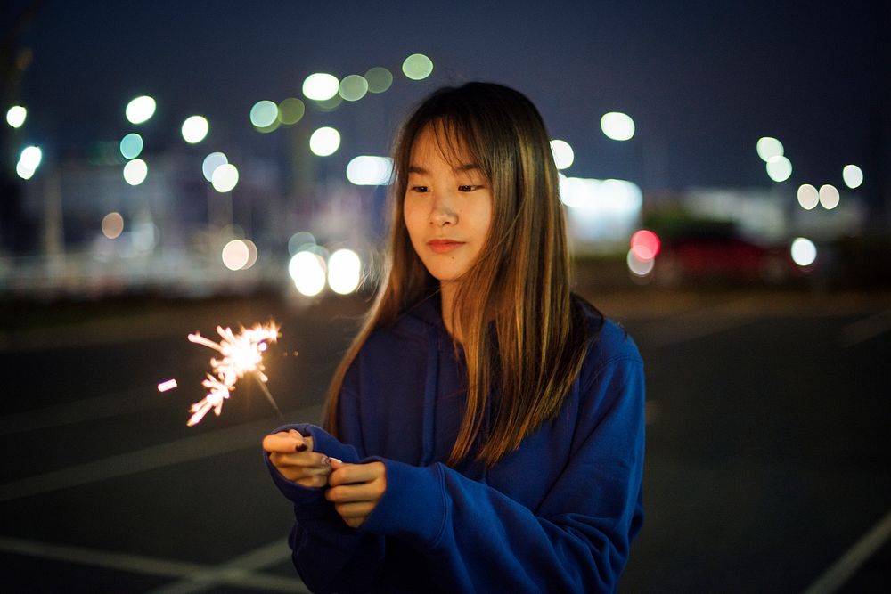 Woman happiness and playing firework