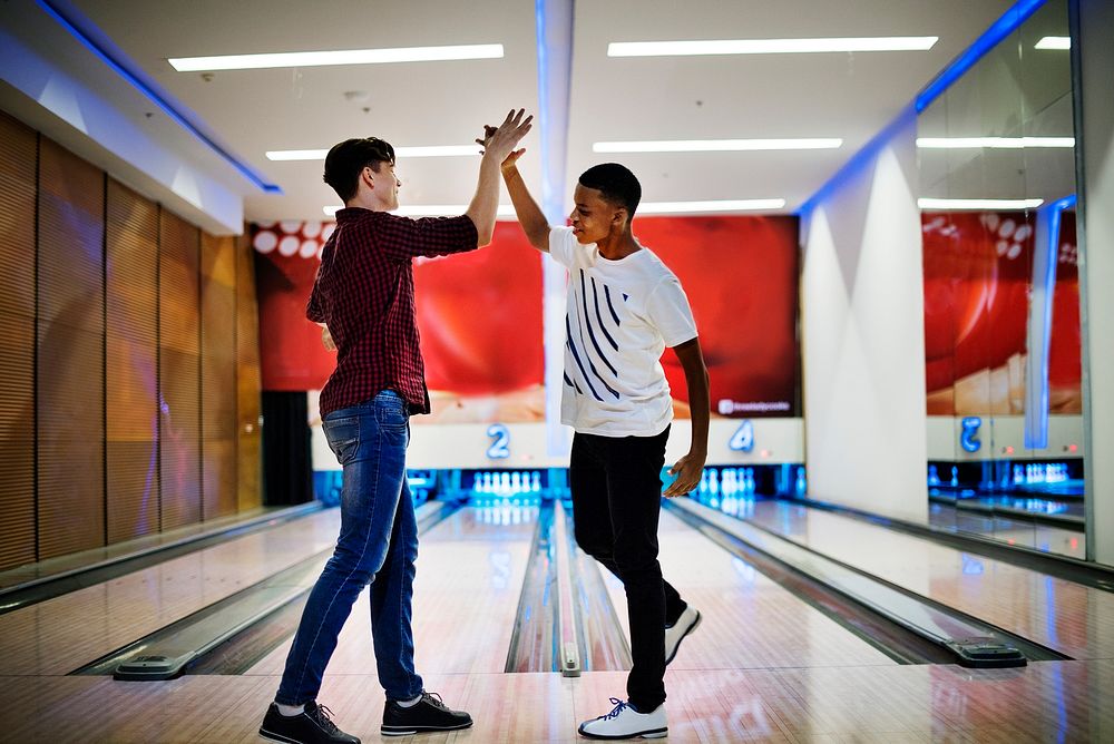 Boys bowling together after school