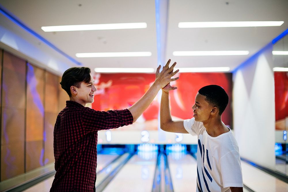 Boys bowling together after school
