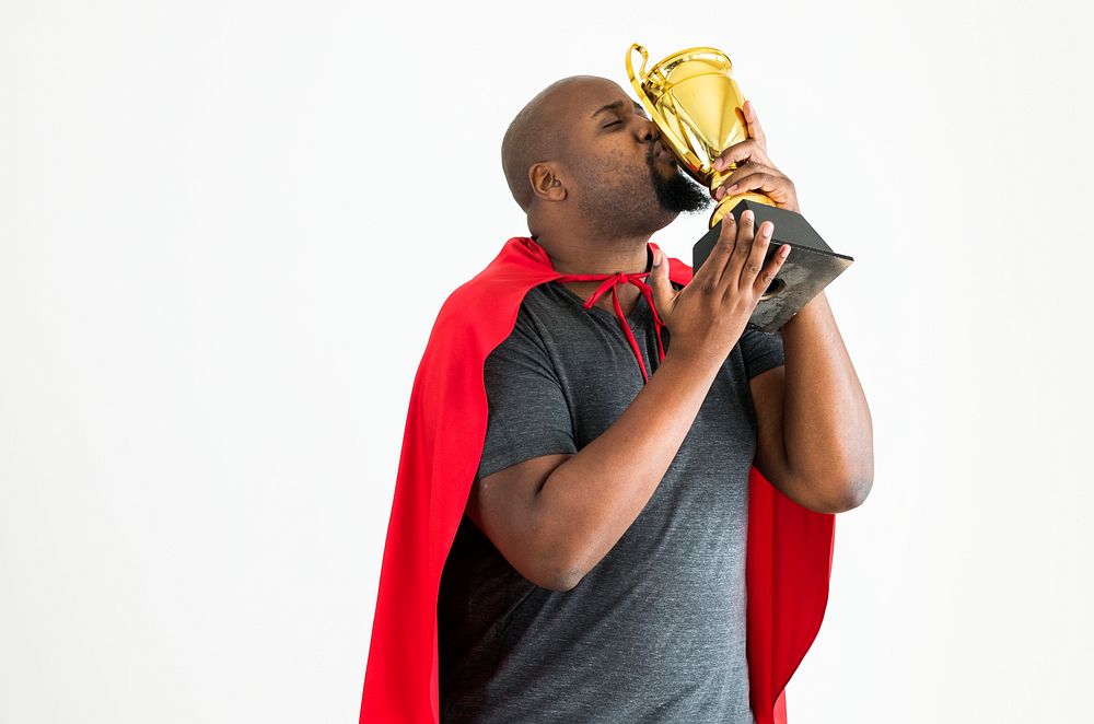 Man kissing the golden trophy winning and victory concept