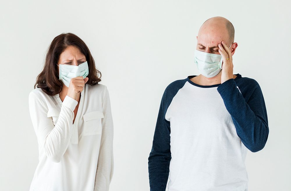 Sick couple wearing surgical mask