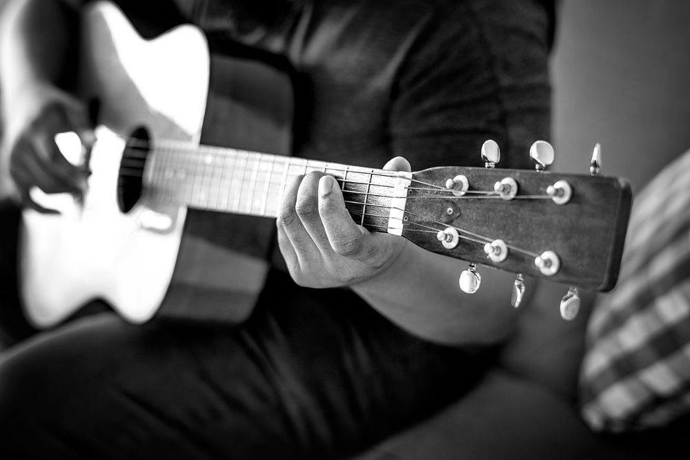 Man playing an acoustic guitar