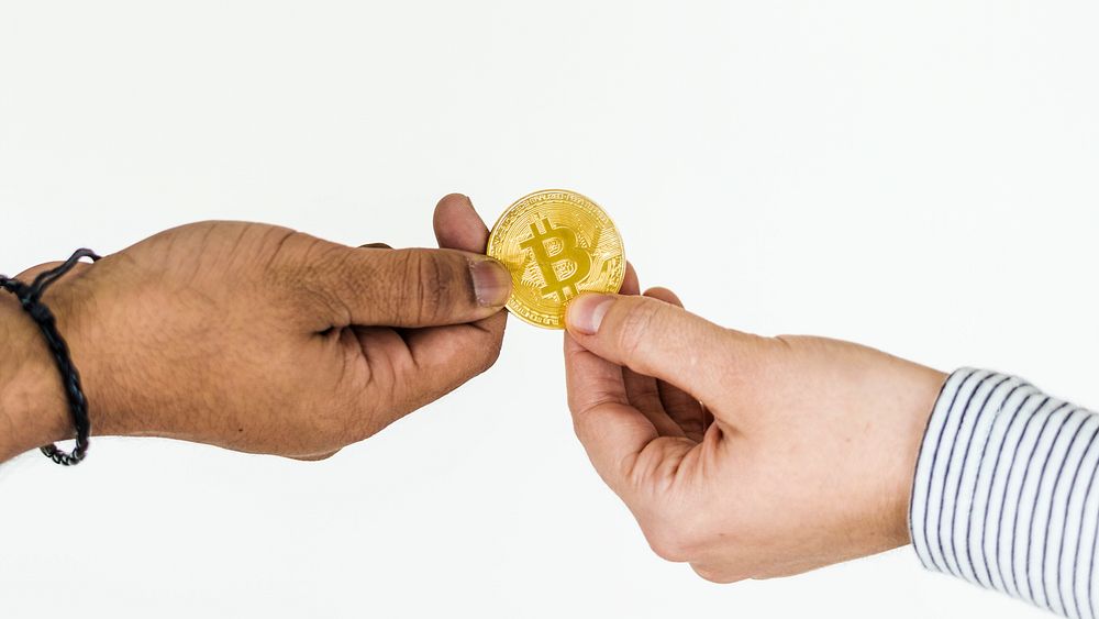 Closeup of exchanging bitcoin isolated on white background