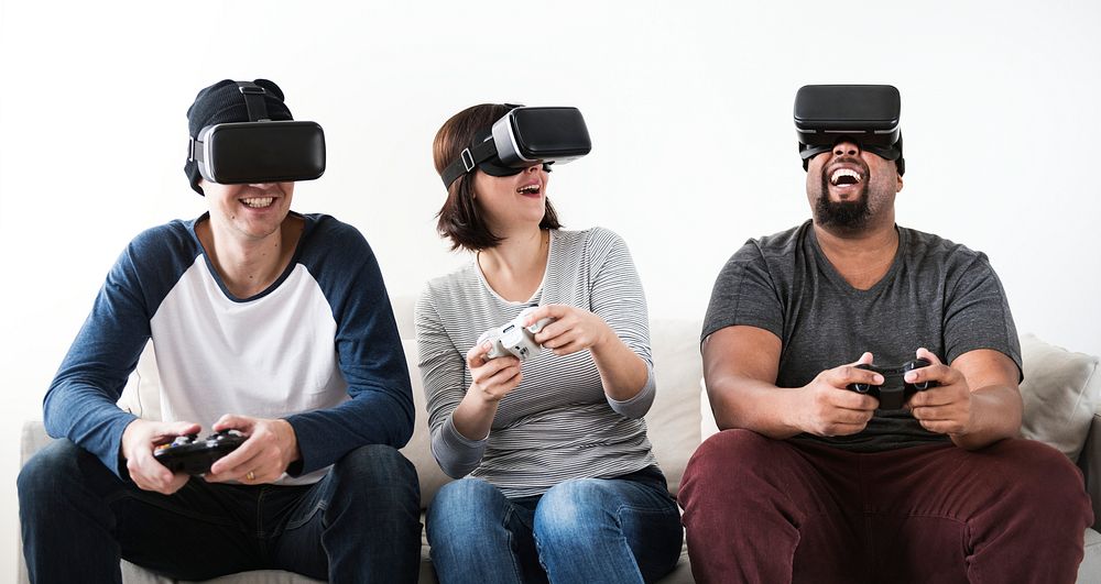 Group of diverse friends enjoying virtual reality game