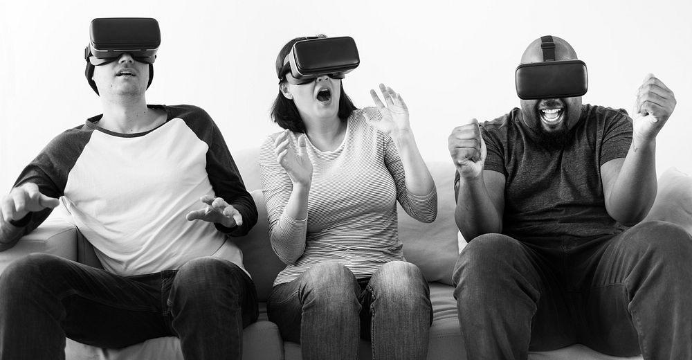 Group of diverse friends enjoying virtual reality experience