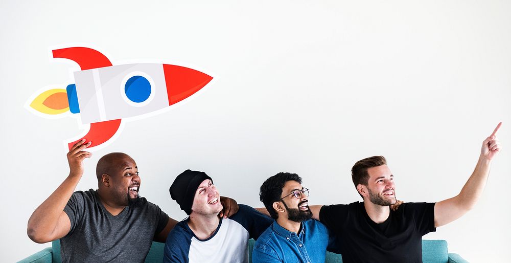 Group of diverse friends sitting on couch with spaceship icon
