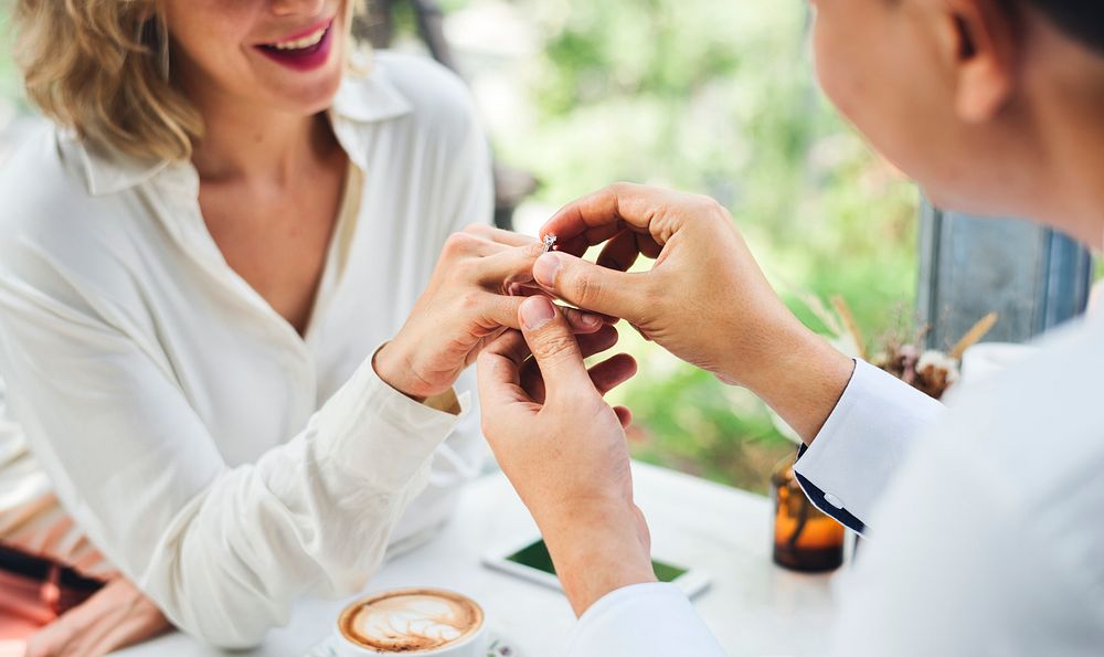 Man proposing girlfriend with diamond ring