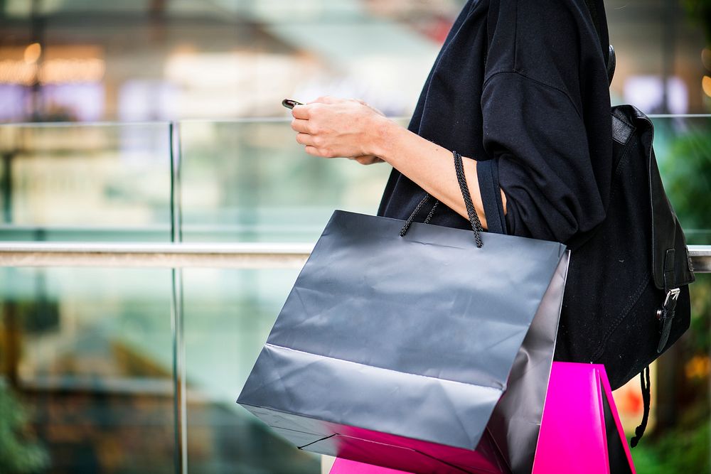 Girl carrying a alot of shopping bags