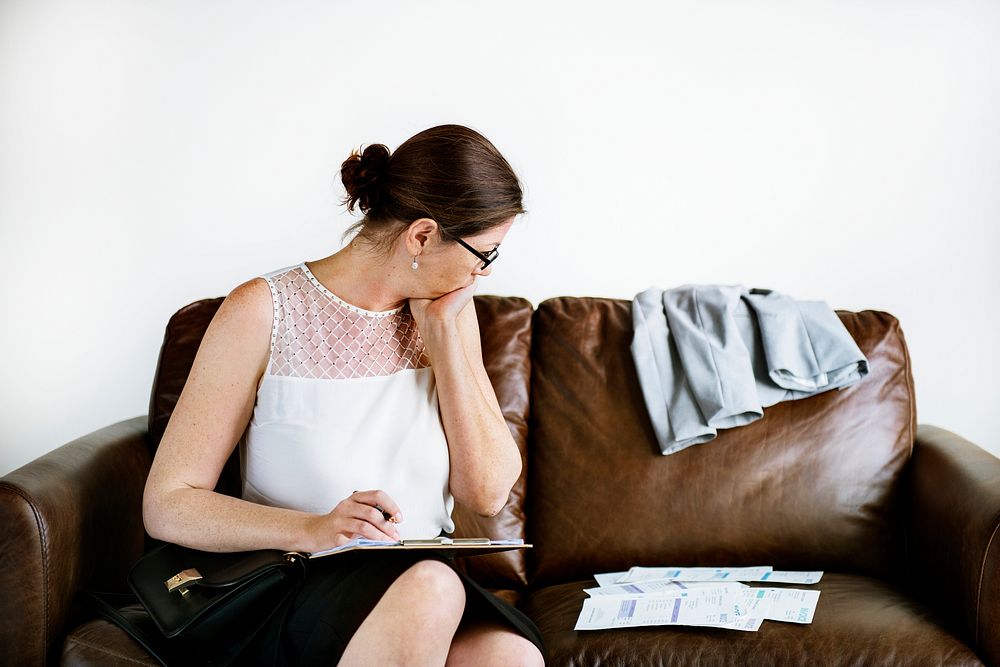 Businesswoman working on a couch