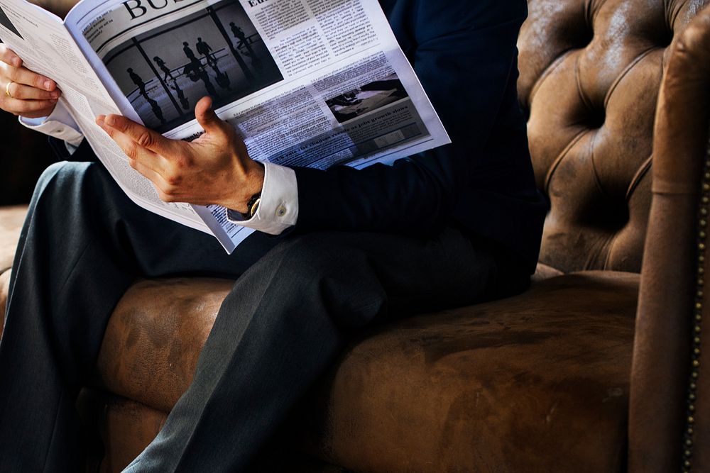 A businessman reading newspaper
